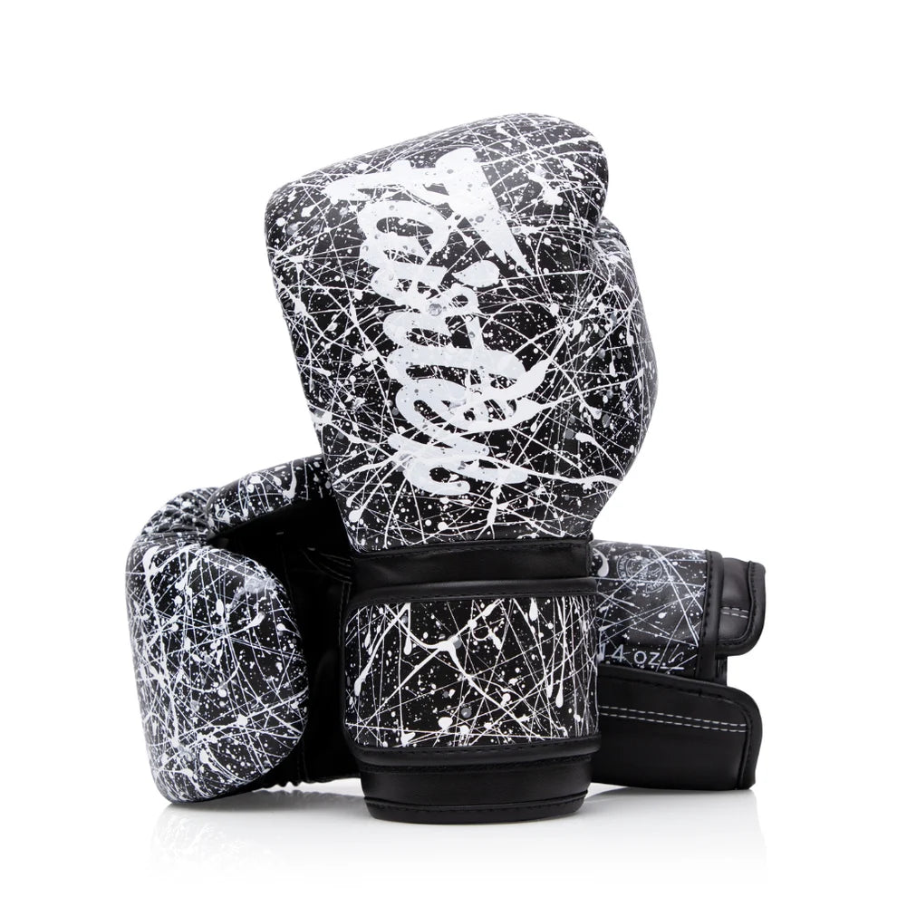 Pair of black and white boxing gloves with a distinctive pattern on a white background