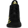 Black high-top sneaker with yellow accents on a white background