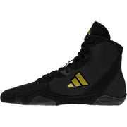 Black Adidas boxing shoe with gold stripes on a white background