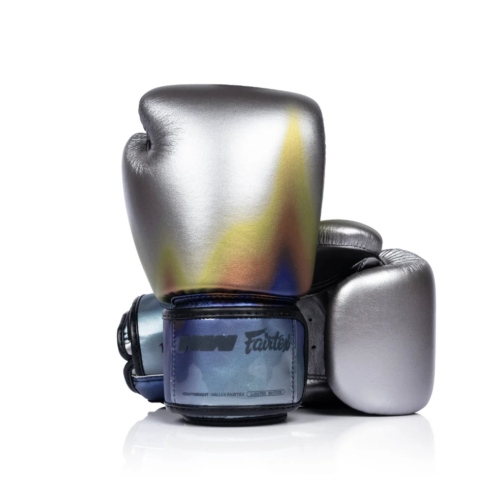 Pair of silver boxing gloves with colorful design on a white background