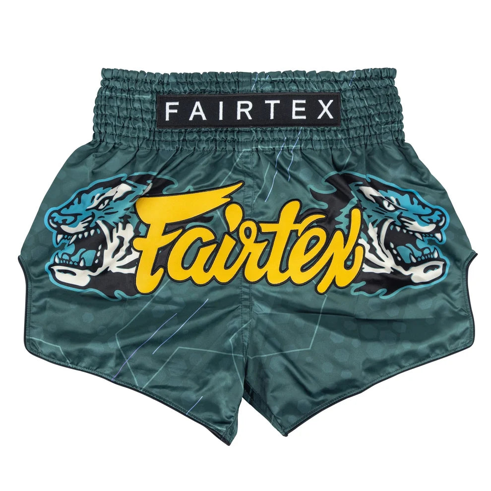 Green Fairtex boxing shorts with tiger design on a white background
