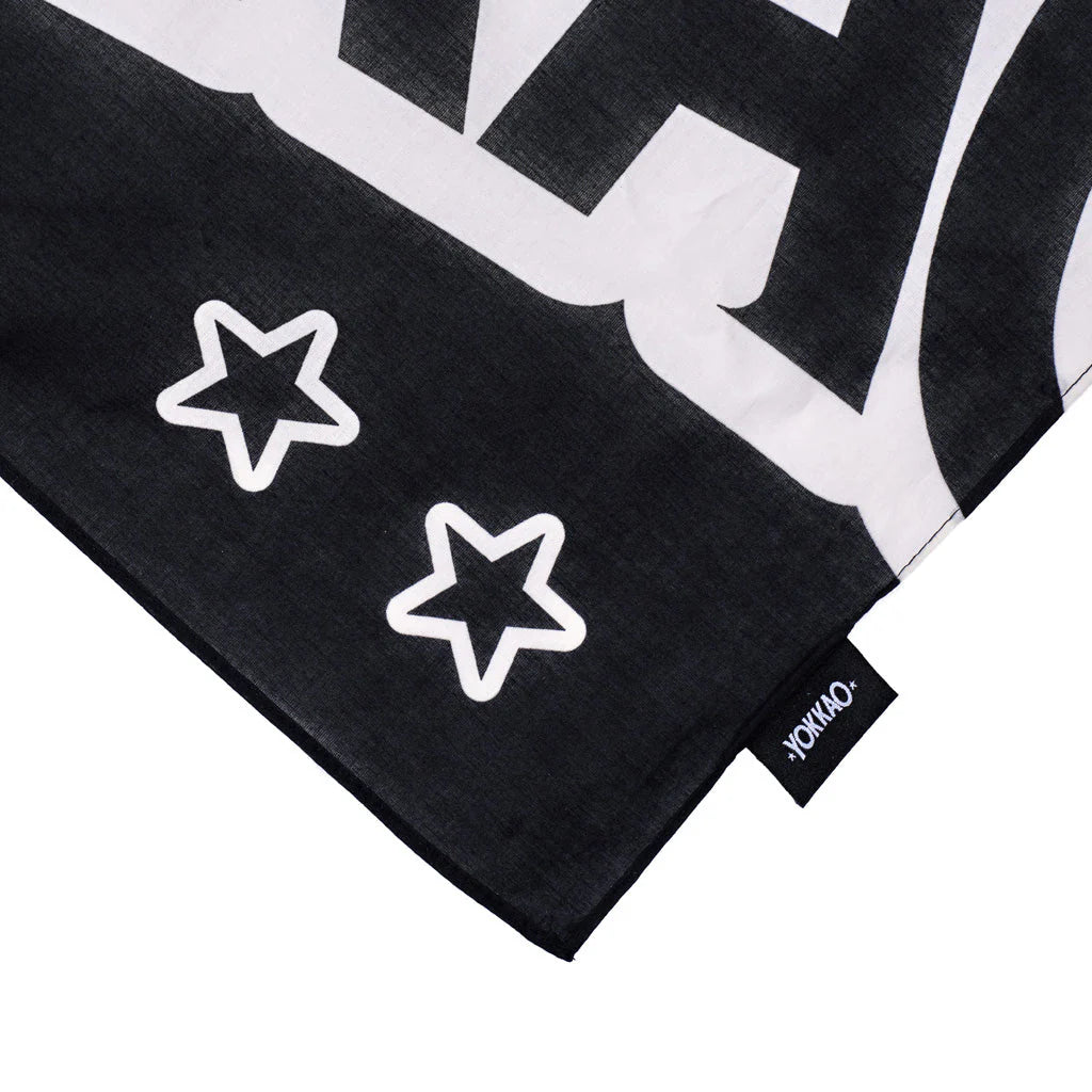 Black and white patterned fabric with star designs and a visible brand tag.