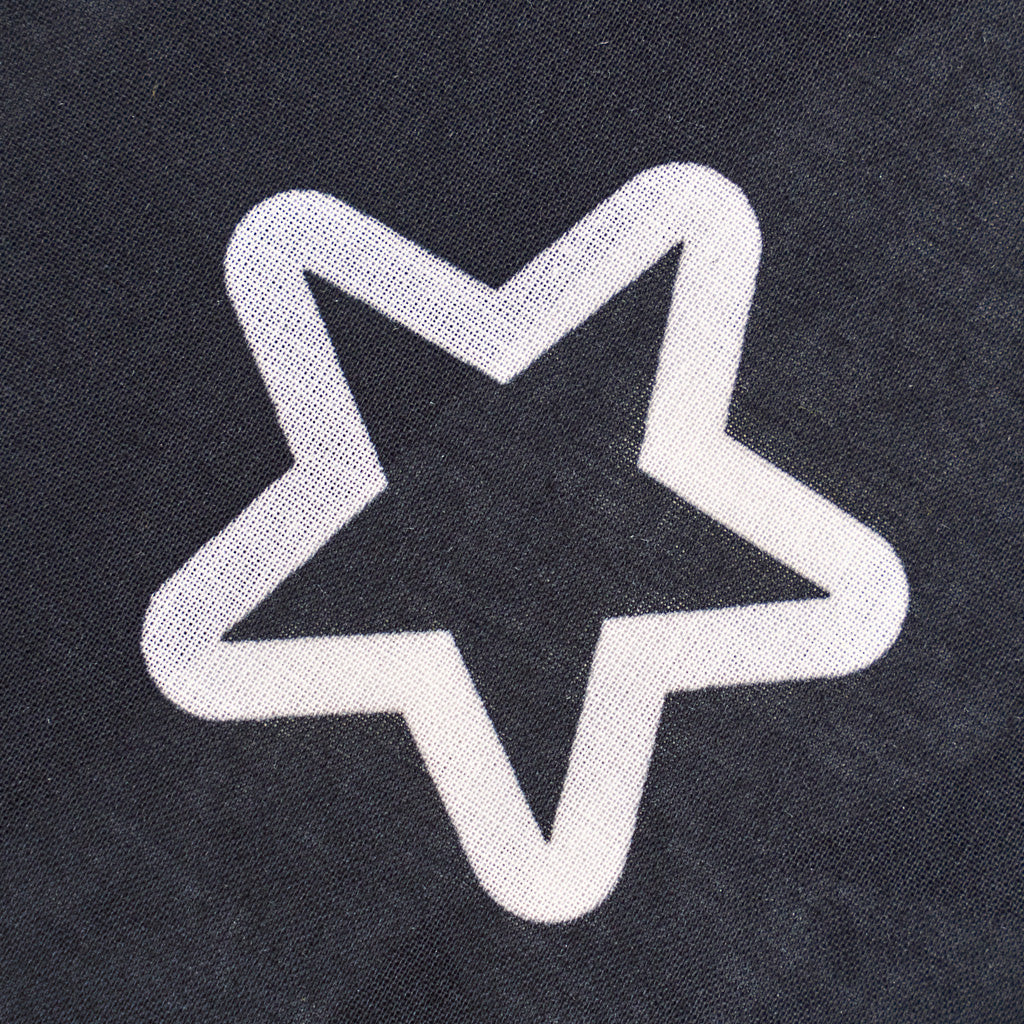 White star design on a dark fabric background