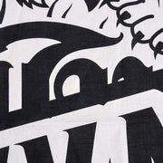 Close-up of a black and white logo on a textured background