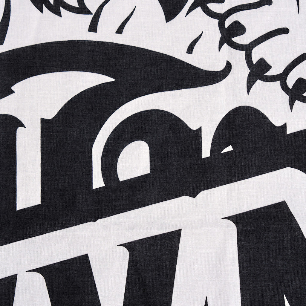 Close-up of a black and white logo on a textured background