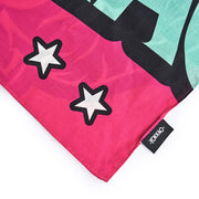 Colorful fabric with star designs and a visible brand label on a white background