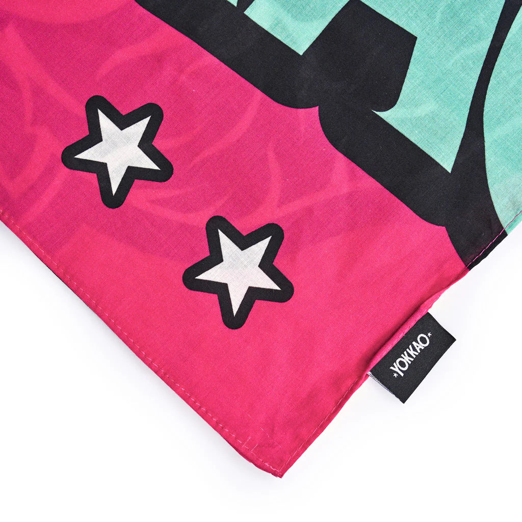 Colorful fabric with star designs and a visible brand label on a white background