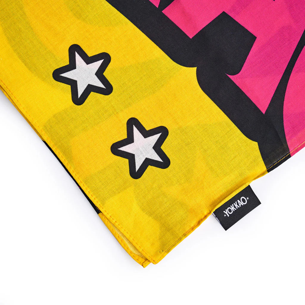 Colorful fabric with star patterns and a visible brand label on a white background