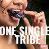 Person wearing a futuristic mouthpiece with text 'ONE SINGLE TRIBE' and Marvel logo.