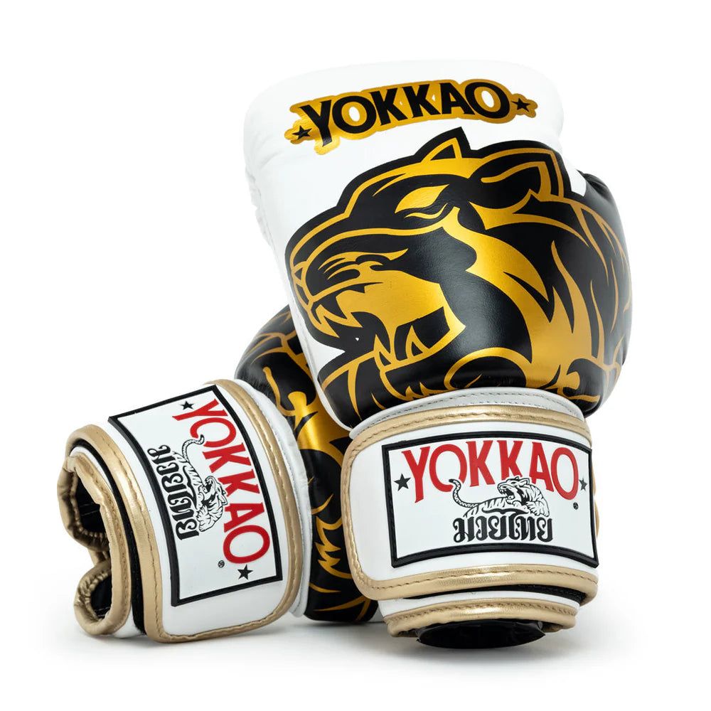 Gold YOKKAO boxing gloves for Muay Thai training and sparring