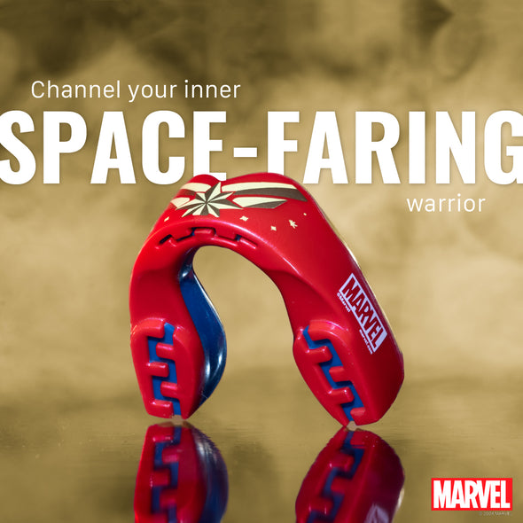 Red and blue helmet with Marvel logo on a reflective surface, text 'Channel your inner SPACE-FARING warrior' above.