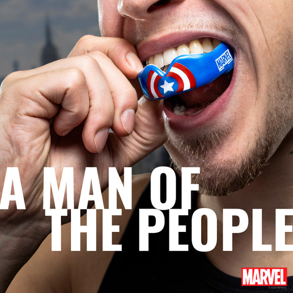 Person wearing a Marvel superhero mouthguard with text 'A Man of the People' and Marvel logo.