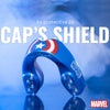 Blue mouthguard with Marvel logo on a blue background, featuring text 'As protective as Cap's Shield'.