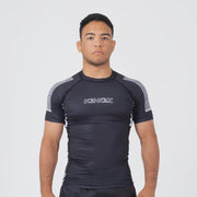 Person wearing a black athletic outfit with 'KINGZ' branding on a white background