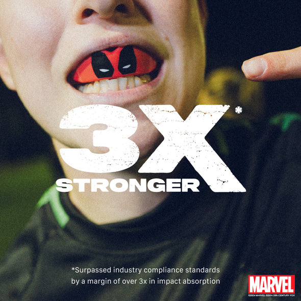 Close-up of a child's mouth with red and black object, text '3X Stronger' and Marvel logo.