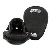 Black martial arts training pads with 'Yokkao' branding on a white background