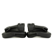 Pair of black wrist guards on a white background