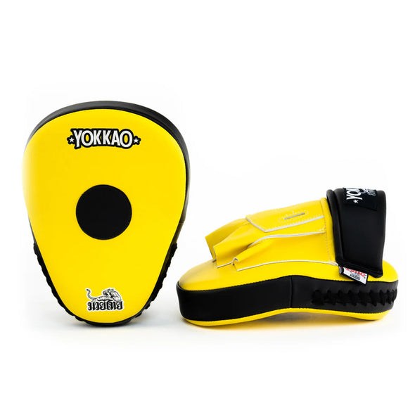 Yellow and black boxing focus mitts with Yokkao branding on a white background
