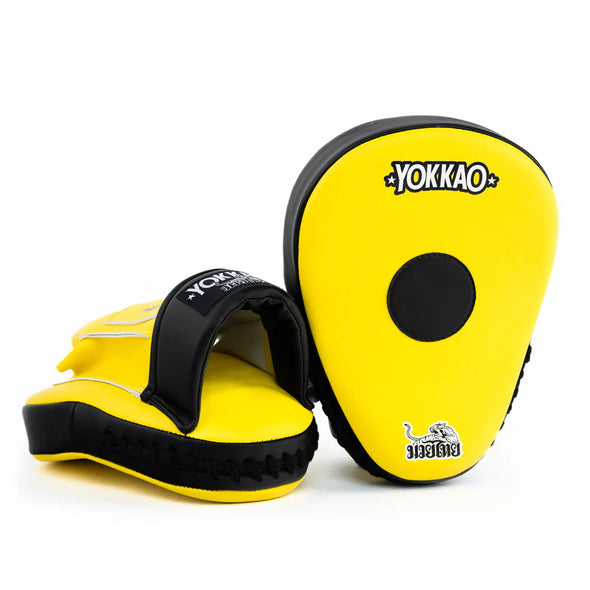 Yellow and black martial arts training pads with 'Yokkao' branding on a white background