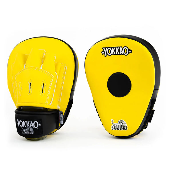 Yellow and black Yokkao boxing focus mitts on a white background