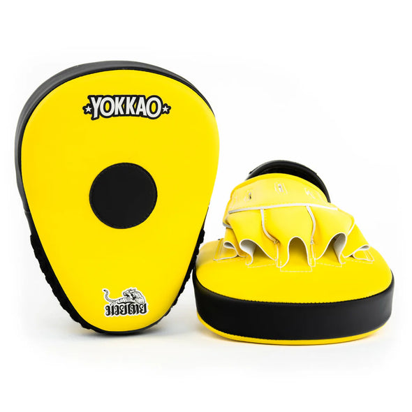 Yellow and black boxing focus mitts with Yokkao branding on a white background