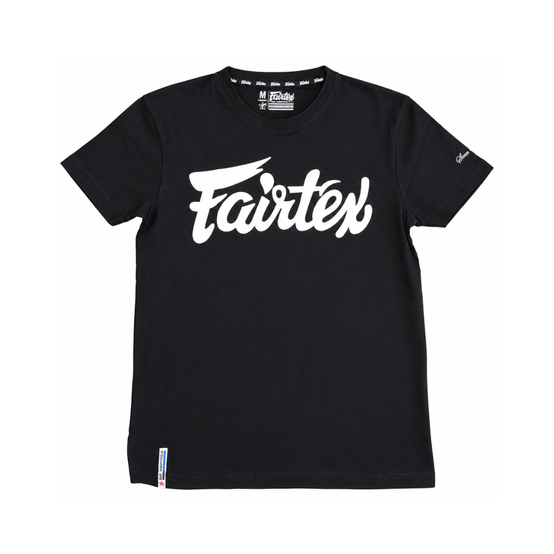 A black short-sleeve t-shirt with a large white 'Fairtex' logo printed across the chest, displayed flat against a solid white background.