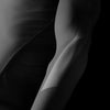 Black and white abstract art with flowing lines on a dark background