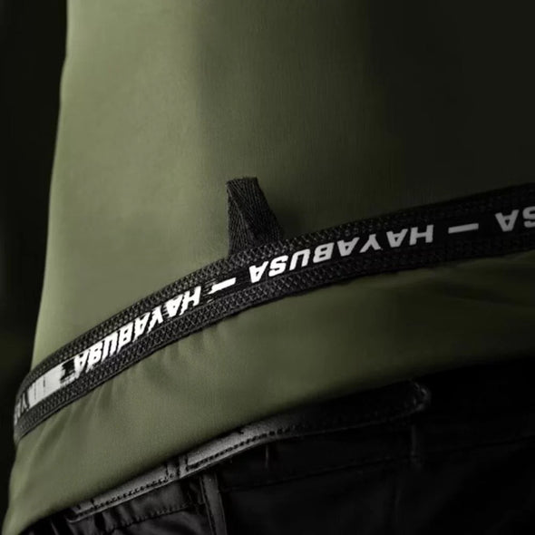 Close-up of a green jacket with a black strap featuring 'HAYABUSA' branding.