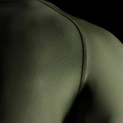 Close-up of a green athletic shirt with textured shoulder area.
