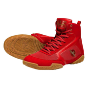 Red high-top sneakers with brown soles on a white background