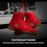 Red high-top sneakers with brown soles on a black background