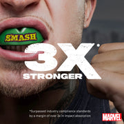 Close-up of a mouth with a green 'SMASH' mouthguard, text '3X STRONGER', and Marvel logo.
