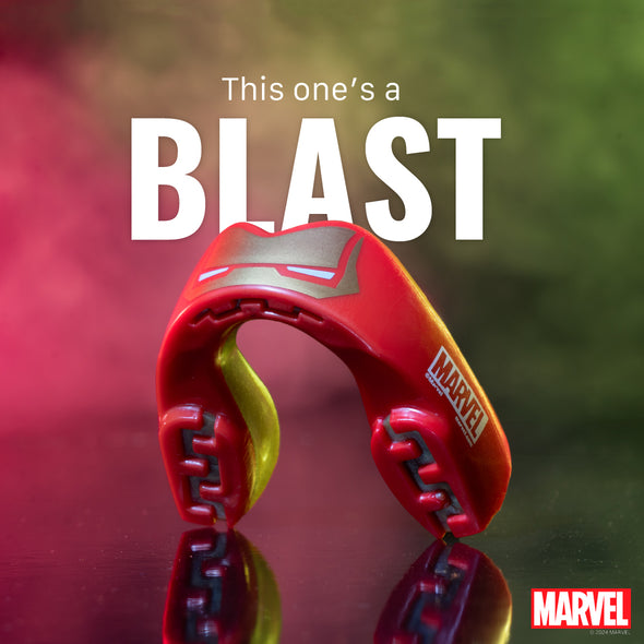 Red and yellow Marvel toy with text 'This one's a BLAST' on a reflective surface.
