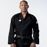 Person wearing a black martial arts uniform on a white background
