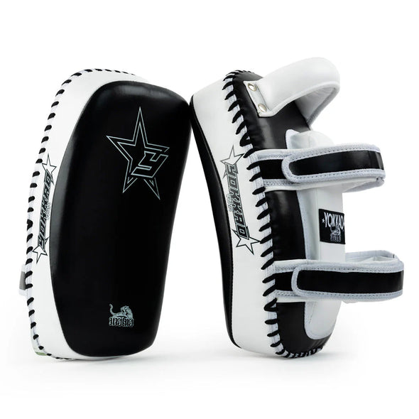 Black and white martial arts training pads with visible branding on a white background