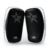 Black and white martial arts training pads with star design on a white background