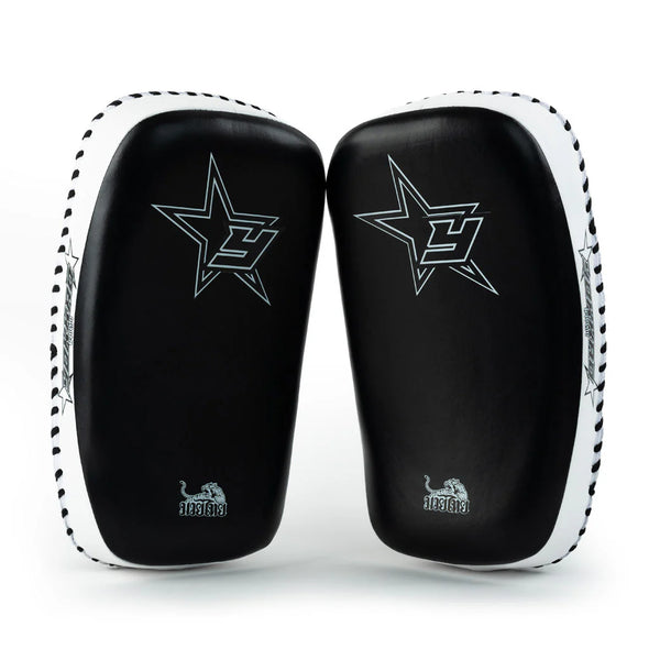 Black and white martial arts training pads with star design on a white background