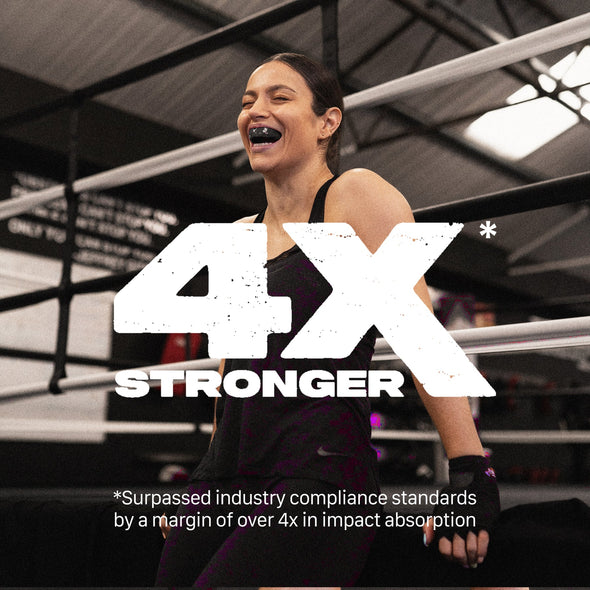 Woman in a boxing ring with '4X Stronger' text overlay