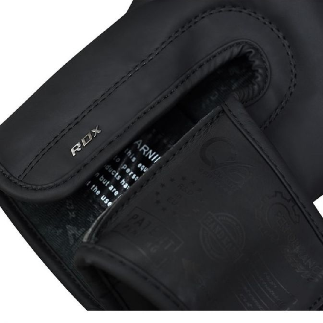 RDX F15 Noir Black Boxing Gloves – Sleek matte black design with layered foam padding, ergonomic wrist support, and ventilation for boxing,mma, and Muay Thai.