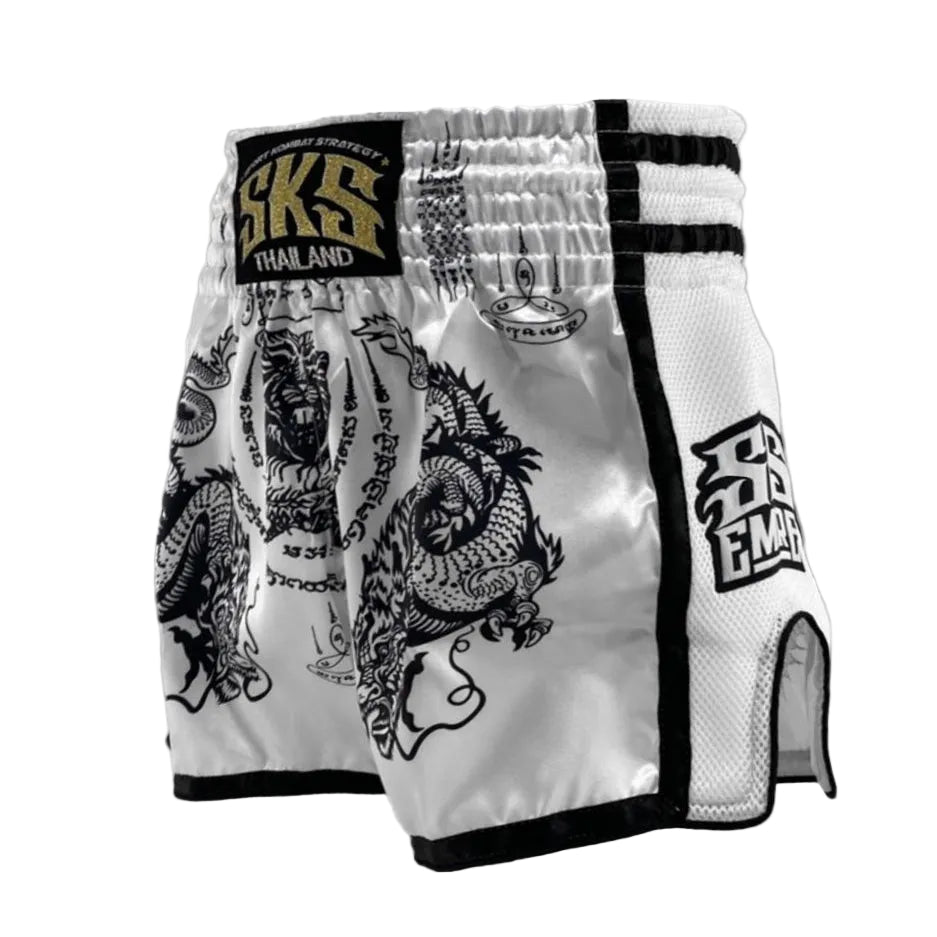 White boxing shorts with black designs and branding on a light gray background