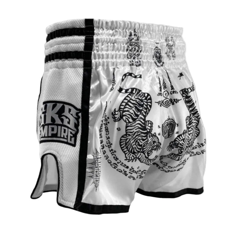 White boxing shorts with black designs and 'Kings Empire' branding on a light gray background