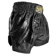 Black Muay Thai shorts with 'Sakai' branding on a gray background