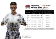 Person wearing boxing gloves with a glove size chart on a white background