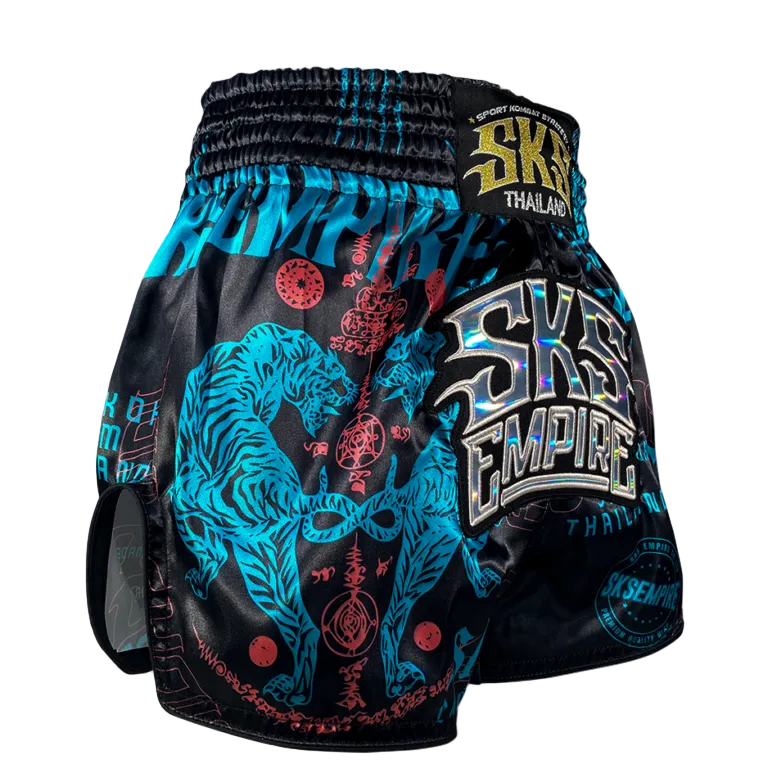 Black and blue boxing shorts with a tiger design and 'Empire' branding on a gray background