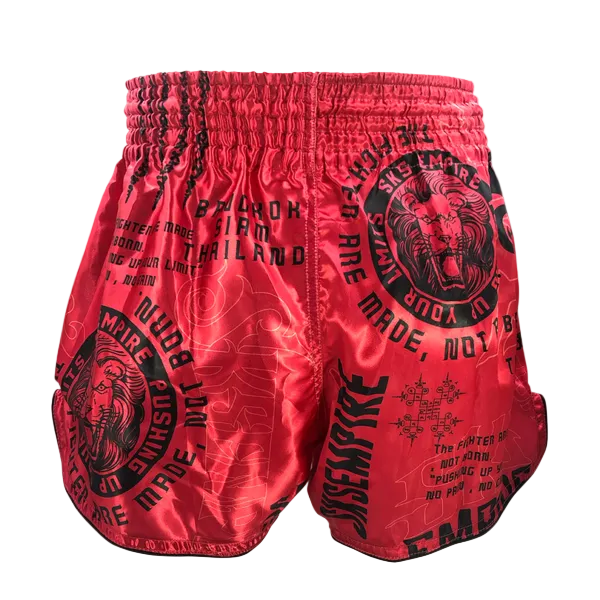 Red boxing shorts with black text and graphics on a gray background