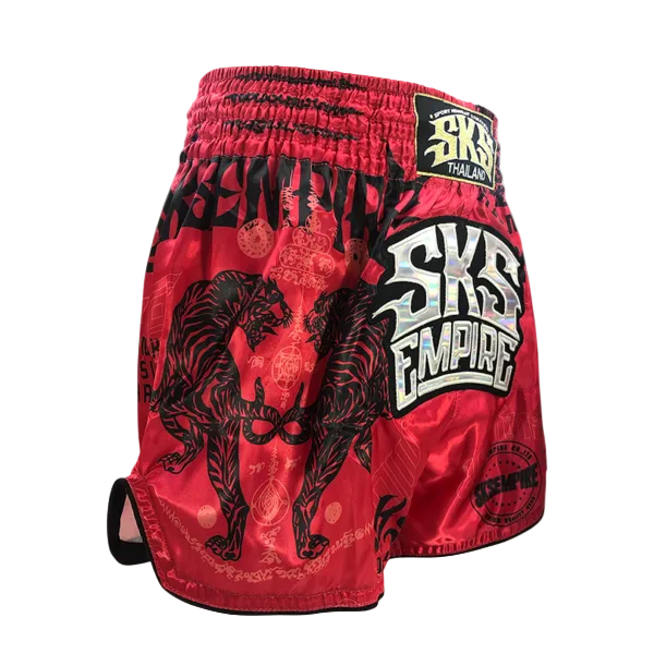 Red boxing shorts with black tiger design and 'SKS Empire' branding on a gray background