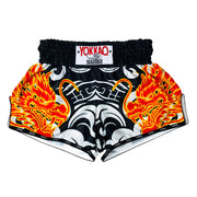 Black shorts with fiery dragon design and Yokkao branding on a white background