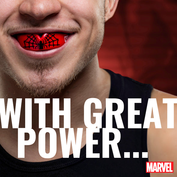 Close-up of a person with a red object in their mouth, featuring the Marvel logo.