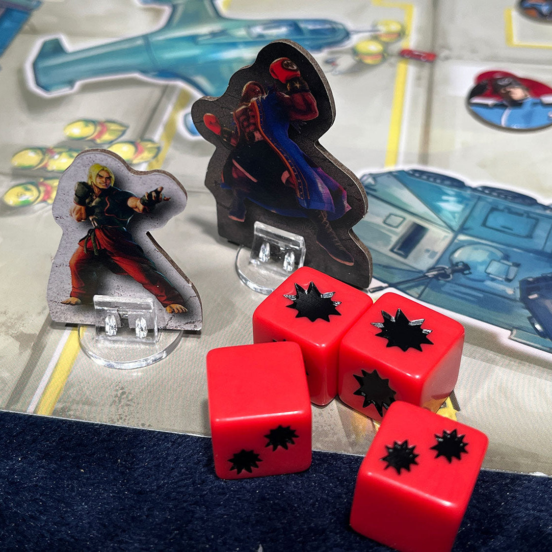 Board game pieces including figures and red dice on a game board