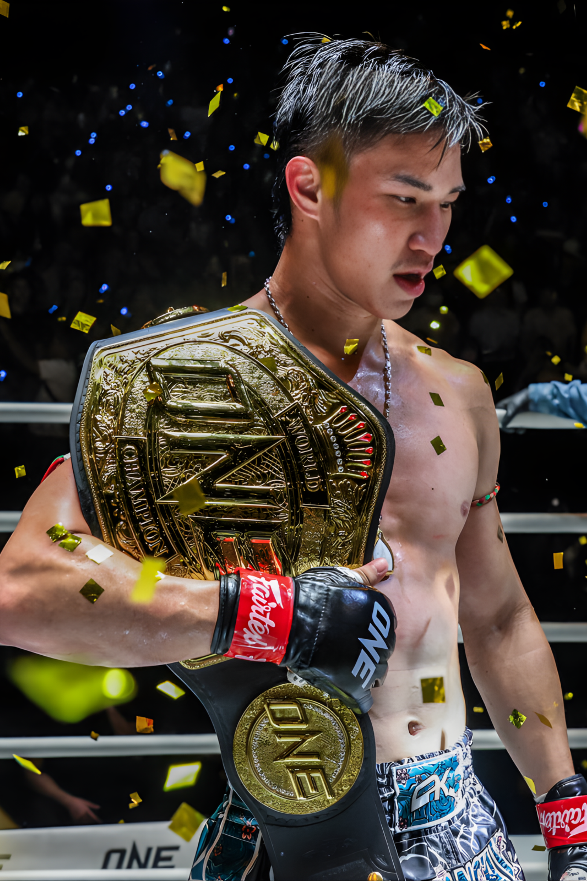Athlete holding a championship belt with confetti in the background